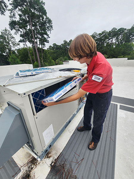 change filter Changing the filter on a large HVAC unit