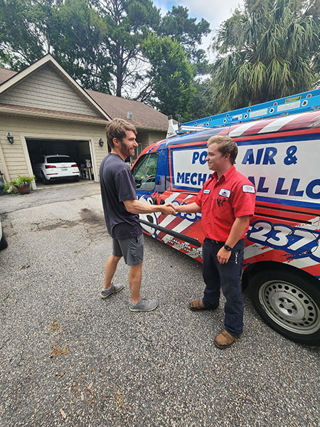 Shaking hands in front of a house Shaking hands in front of a house
